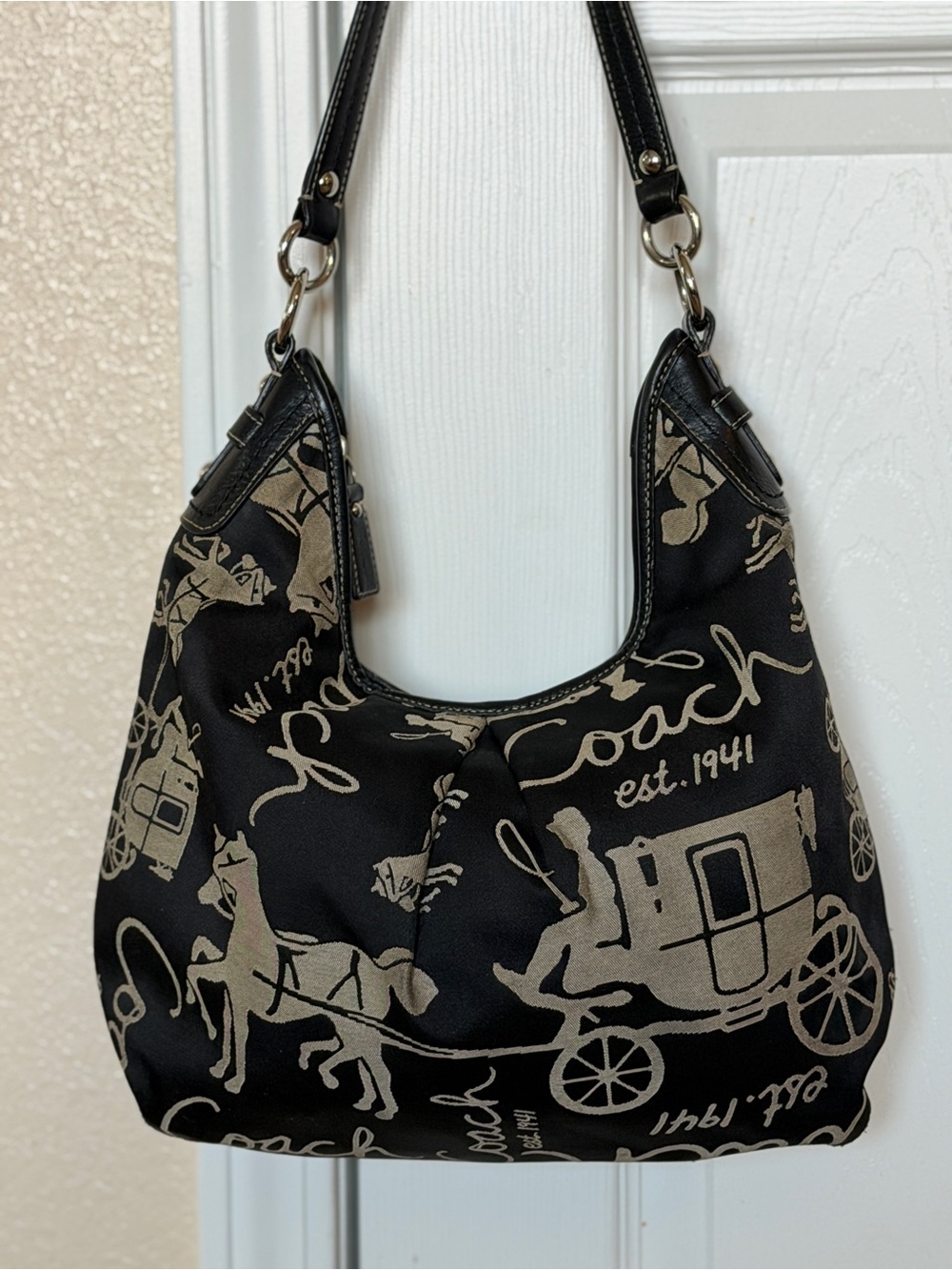 Coach Black Hobo with Tan Carriage Script Motif
